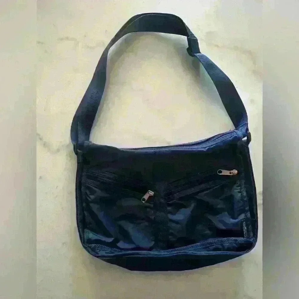 American Tourister dark blue nylon adjustable strap crossbody bag.